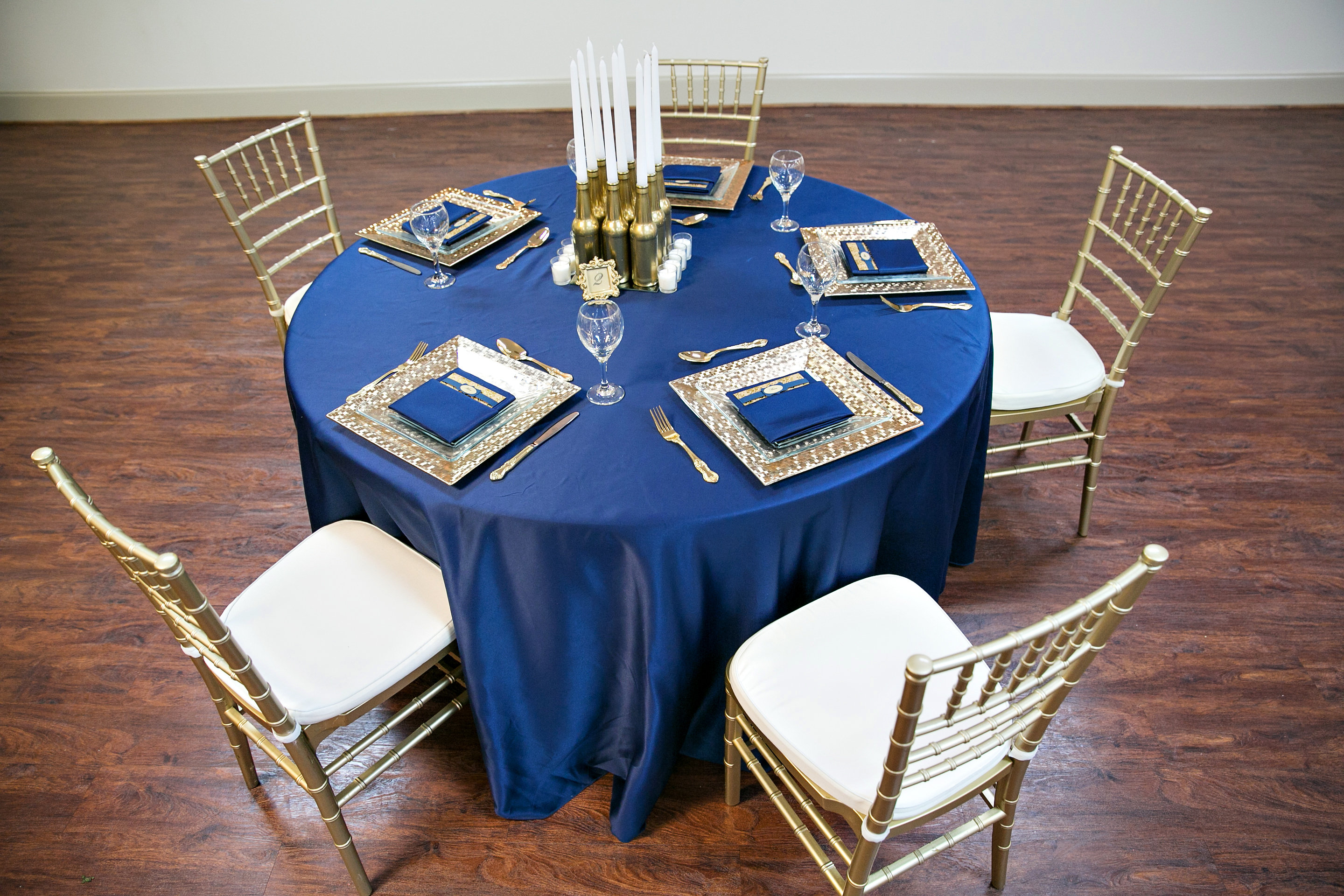 Main hall set with round tables and chairs for a reception.
